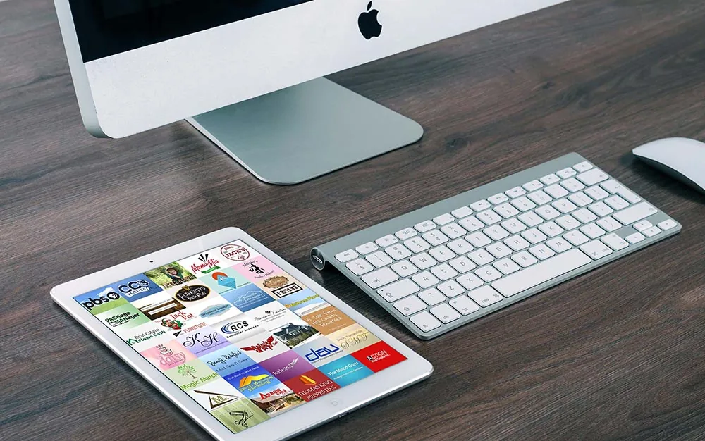 Pioneer Media portfolio on a Mac computer and iPad