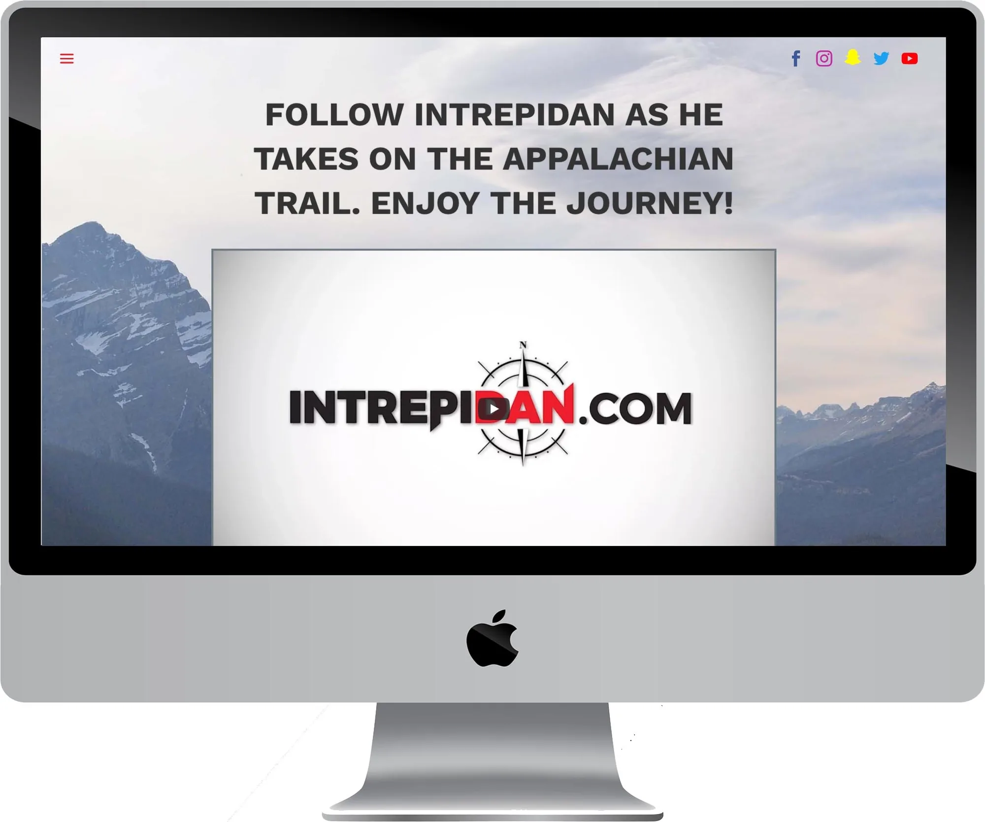 IntrepiDan website design on a desktop computer